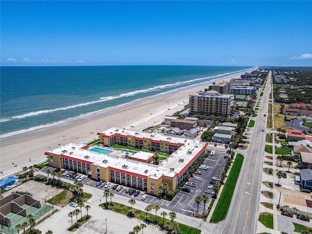 aerial view featuring a view of the beach and a water view