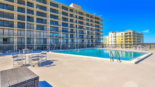 view of swimming pool with a patio area