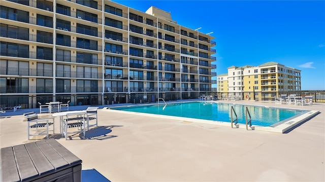 view of swimming pool featuring a patio