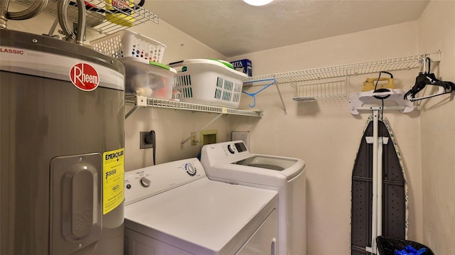 4139 Atlantic Unit A406, New Smyrna Beach, FL 32169 - washroom featuring separate washer and dryer and electric water heater