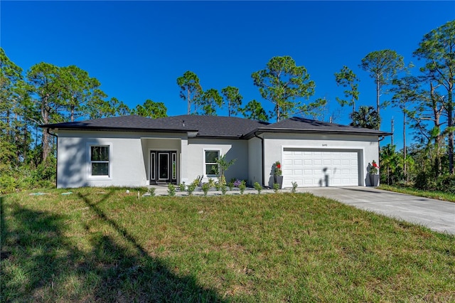 single story home with a front yard and a garage