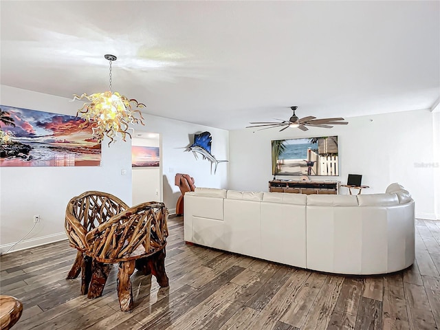 living room featuring dark hardwood / wood-style flooring and ceiling fan