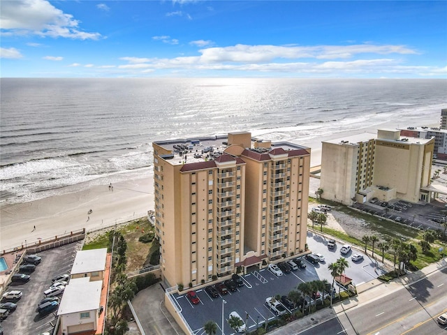 aerial view featuring a water view and a beach view