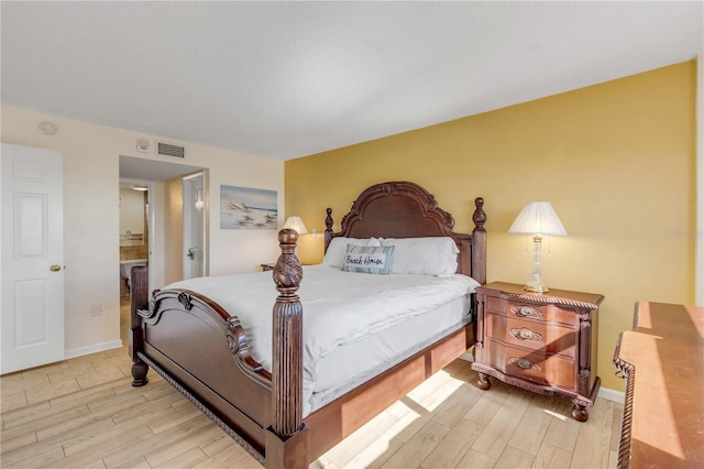 bedroom with light hardwood / wood-style floors