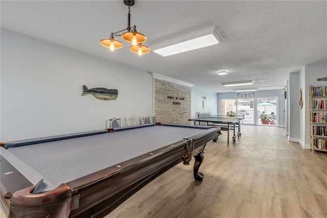 playroom featuring a textured ceiling, light wood-type flooring, and billiards