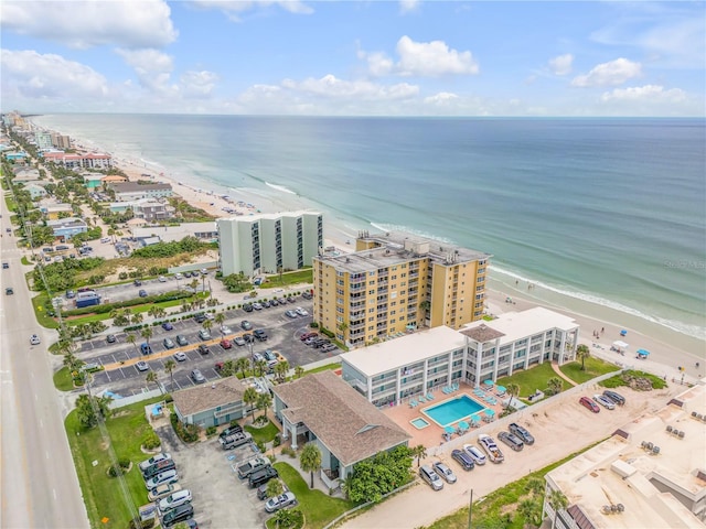 aerial view featuring a view of the beach and a water view