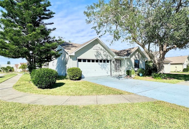 view of front of house with a front yard and a garage