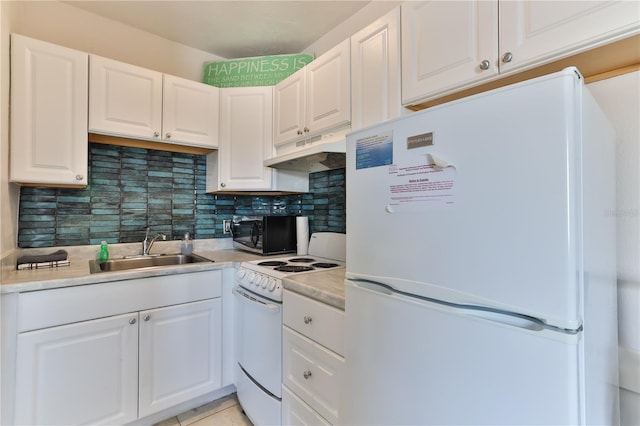 kitchen with custom range hood, white cabinets, white appliances, and sink