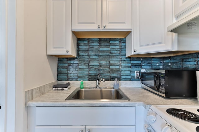 kitchen featuring ventilation hood, backsplash, white cabinetry, and sink