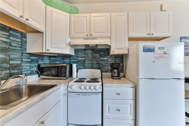 kitchen featuring white appliances, tasteful backsplash, white cabinetry, and sink