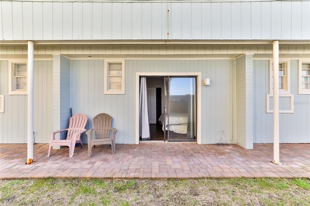 property entrance featuring a patio