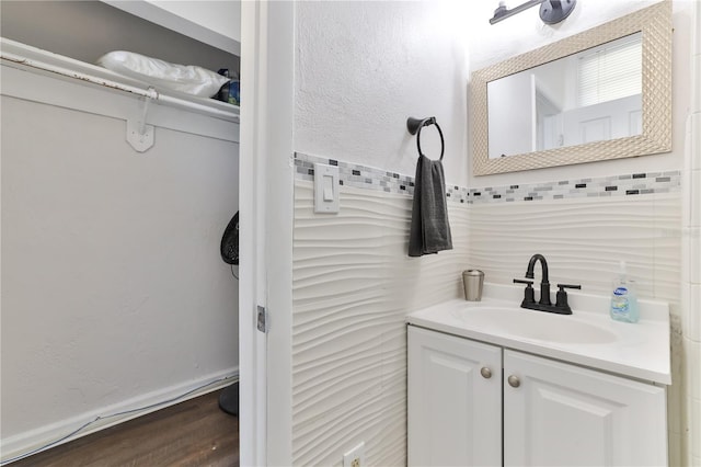 bathroom featuring vanity and wood-type flooring