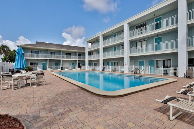 view of pool featuring a patio