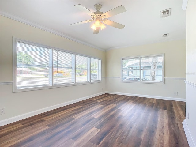 unfurnished room with crown molding, ceiling fan, and dark hardwood / wood-style floors