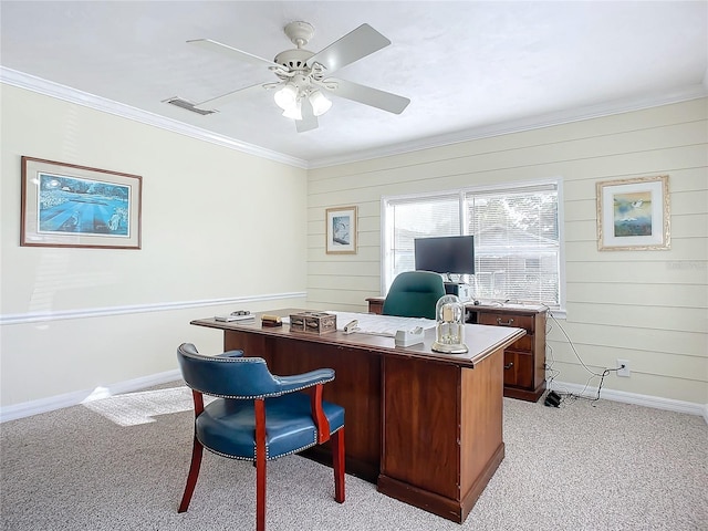 office space featuring ceiling fan, light colored carpet, crown molding, and wooden walls