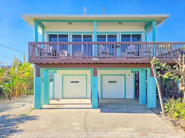 view of front of house featuring a deck and a garage