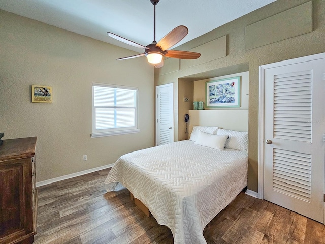 bedroom featuring ceiling fan and dark hardwood / wood-style flooring