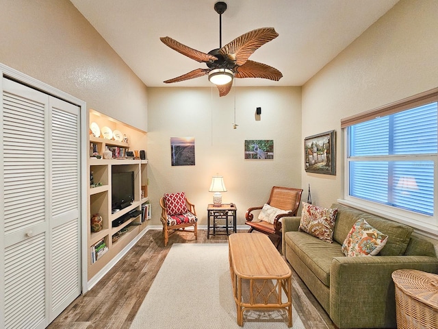 living room with ceiling fan and dark hardwood / wood-style floors