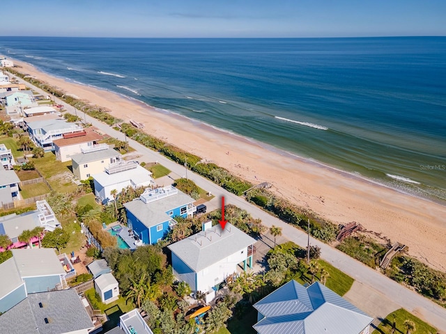 aerial view with a view of the beach and a water view