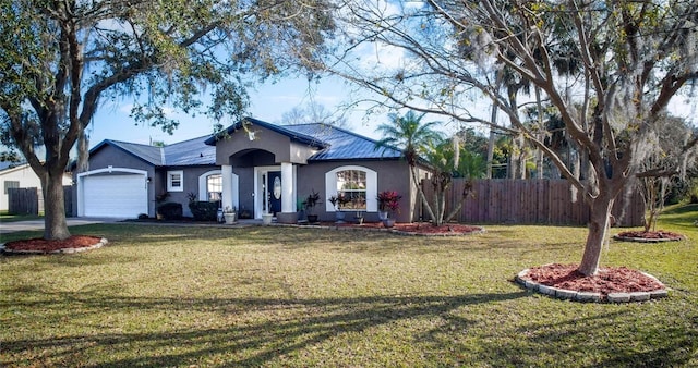 view of front of house featuring a front yard and a garage