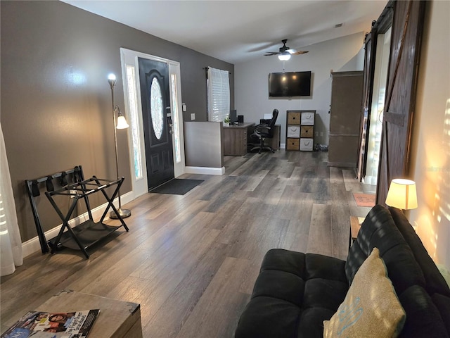 entrance foyer featuring ceiling fan and dark wood-type flooring