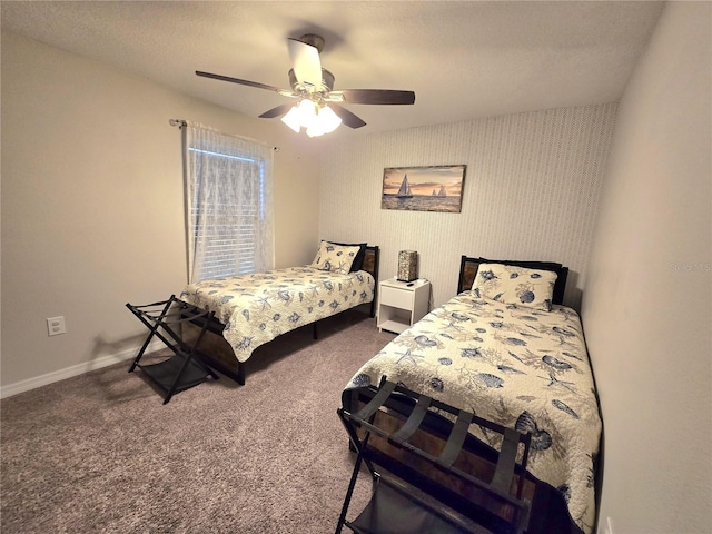 carpeted bedroom with a textured ceiling and ceiling fan