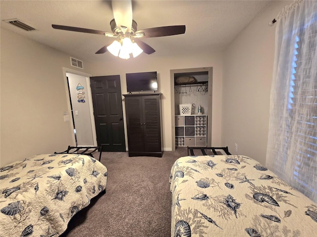 bedroom featuring dark carpet and ceiling fan