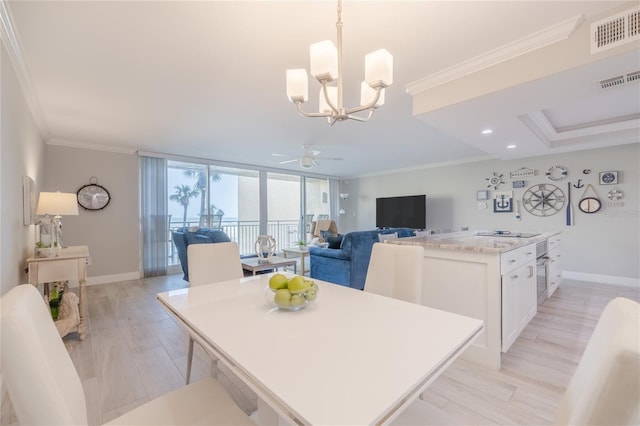 2401 S Atlantic Ave Unit C206, New Smyrna Beach, FL 32169 - dining area featuring light wood finished floors, ornamental molding, a chandelier, a ceiling fan, and recessed lighting