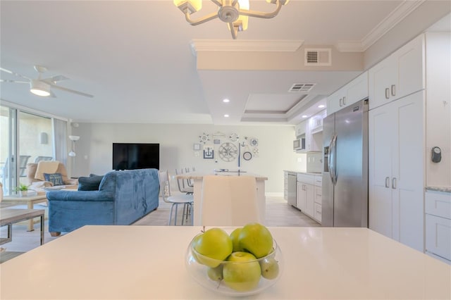 2401 S Atlantic Ave Unit C206, New Smyrna Beach, FL 32169 - dining space featuring a ceiling fan, light wood-style floors, crown molding, and recessed lighting