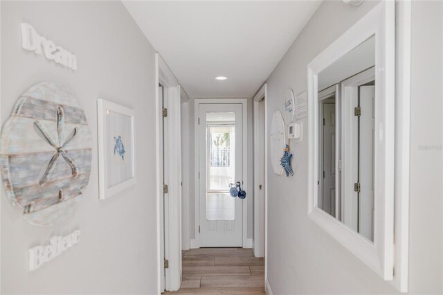 corridor featuring light hardwood / wood-style floors