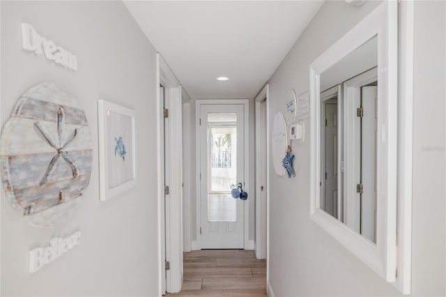2401 S Atlantic Ave Unit C206, New Smyrna Beach, FL 32169 - hallway with light wood-style floors and recessed lighting