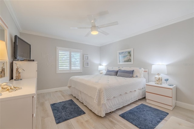 bedroom featuring ceiling fan, light hardwood / wood-style floors, and crown molding