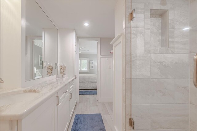 2401 S Atlantic Ave Unit C206, New Smyrna Beach, FL 32169 - bathroom featuring a stall shower, vanity, ensuite bathroom, and recessed lighting
