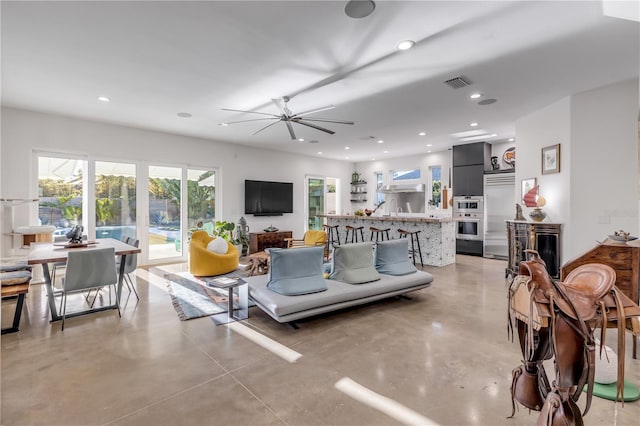 living room featuring an inviting chandelier