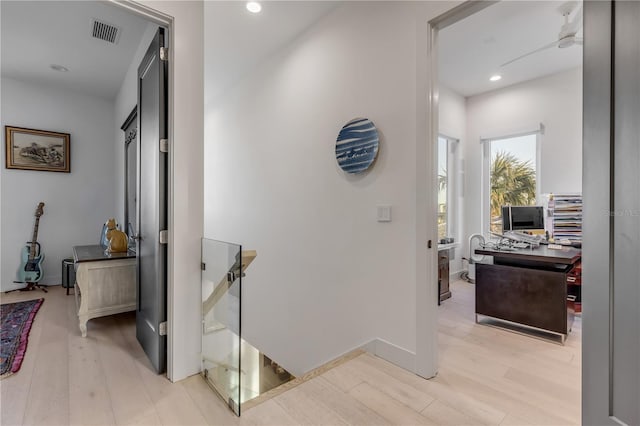 corridor featuring light hardwood / wood-style floors