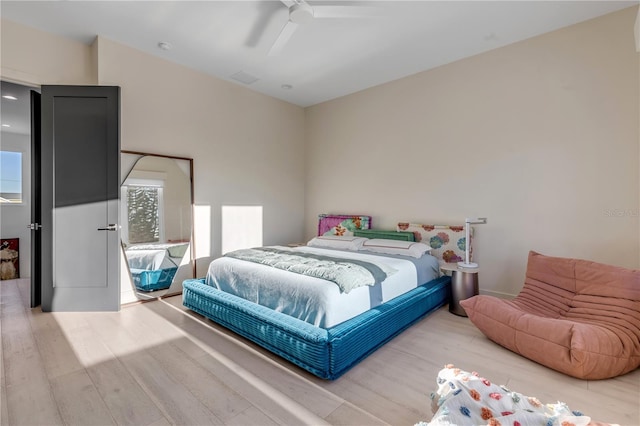 bedroom featuring ceiling fan and wood-type flooring