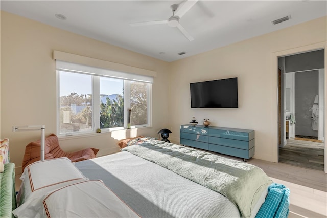 bedroom featuring ceiling fan and light hardwood / wood-style flooring