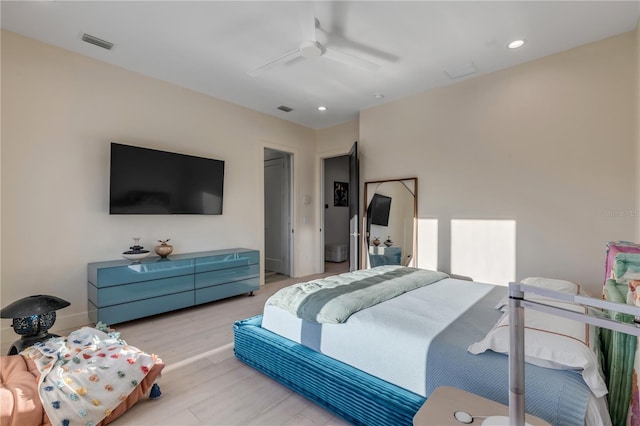 bedroom featuring light hardwood / wood-style floors and ceiling fan