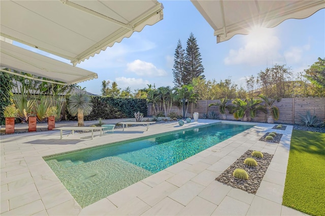 view of swimming pool featuring a patio