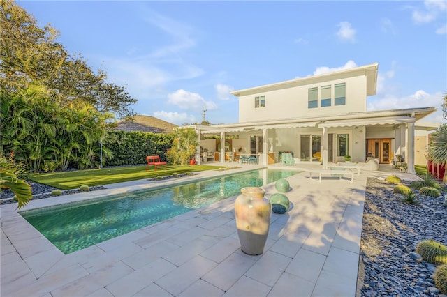 view of swimming pool with a patio and french doors