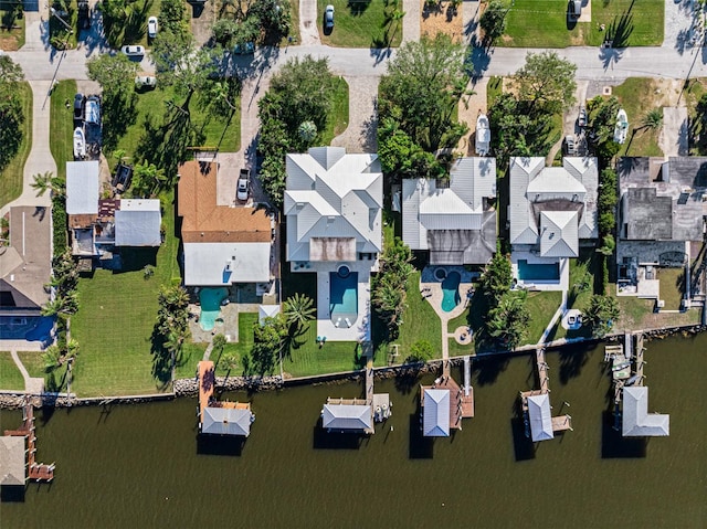 birds eye view of property featuring a water view