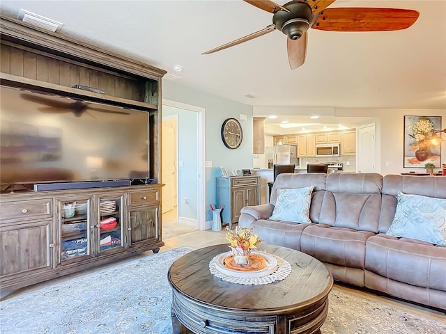 5300 S Atlantic Ave Unit 17-506, New Smyrna Beach, FL 32169 - living room featuring a ceiling fan and baseboards