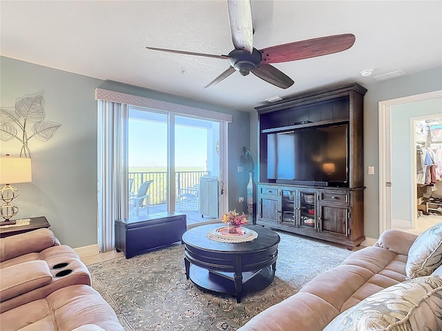 living room featuring ceiling fan