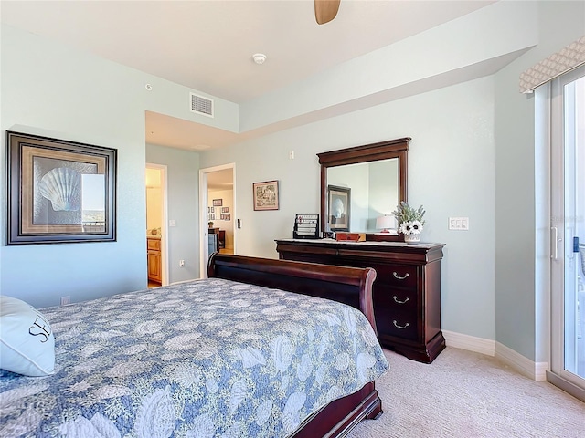 bedroom with ceiling fan, light carpet, and connected bathroom