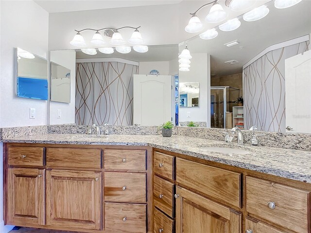 bathroom with vanity and walk in shower