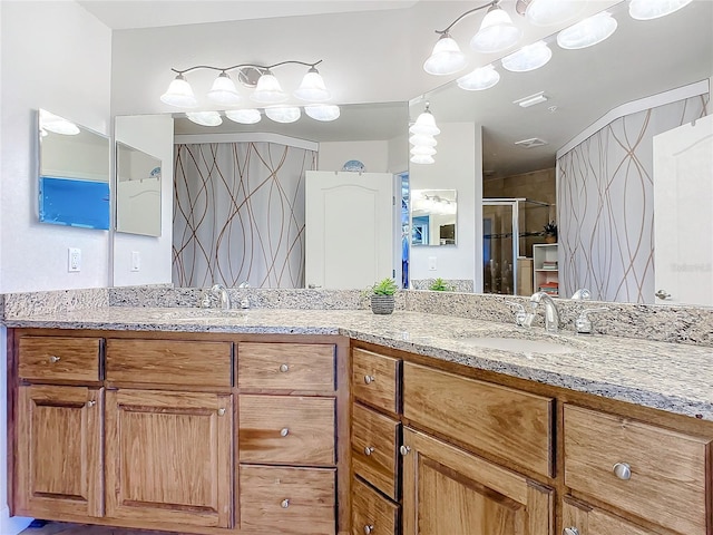 5300 S Atlantic Ave Unit 17-506, New Smyrna Beach, FL 32169 - full bathroom featuring double vanity and a shower stall