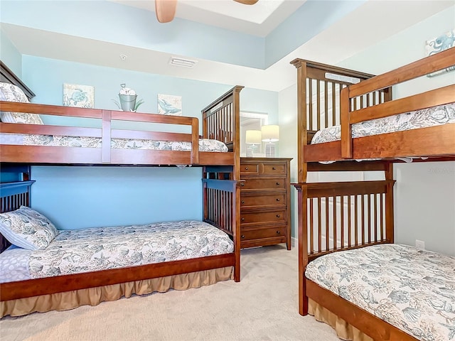 bedroom with light carpet and ceiling fan