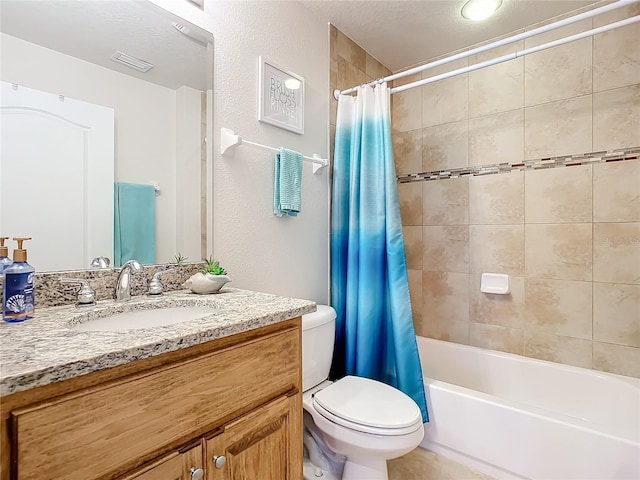 full bathroom with a textured ceiling, vanity, toilet, and shower / bath combo with shower curtain