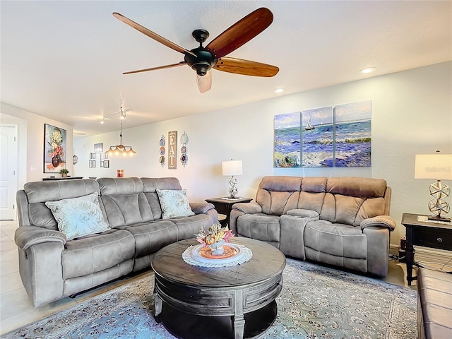 living room with ceiling fan and light tile patterned floors