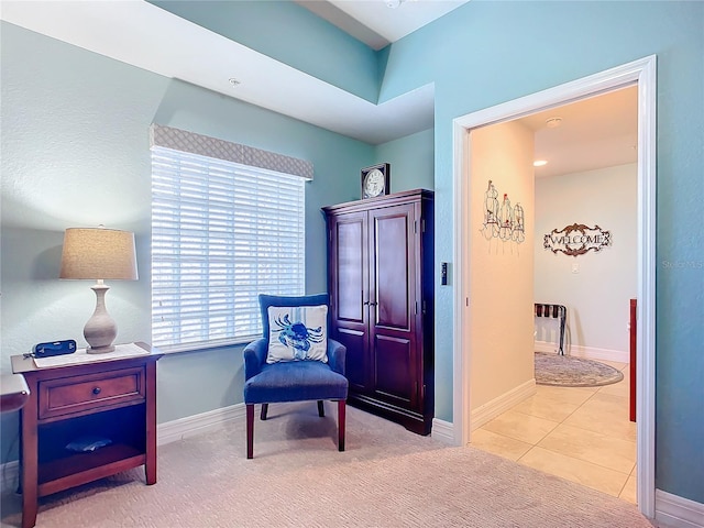 living area with light tile patterned floors